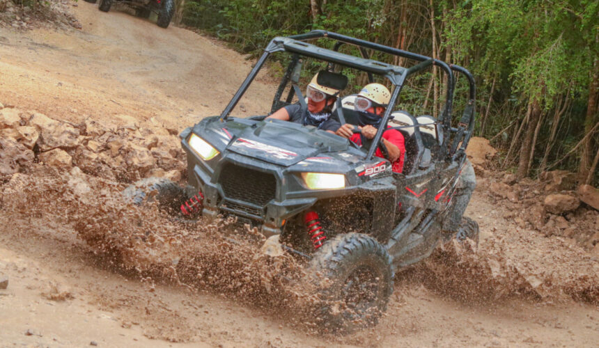 1POLARIS-1-860x500 Off-road vehicle driving through rugged terrain supports adventure activities for groups.